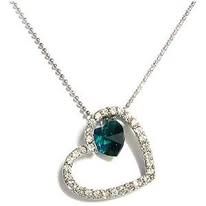 Silver necklace with a heart-shaped pendant, studded with clear crystals and a teal-colored gemstone.