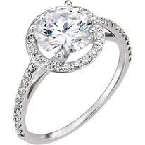 Diamond ring with a large center stone and halo of smaller diamonds on a white gold band.