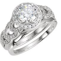 Sterling silver bridal set with a round center diamond, halo, and pavé details.