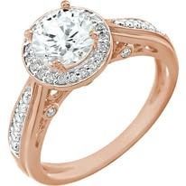 Rose gold ring with a large central clear stone surrounded by smaller stones.