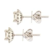Diamond stud earrings with white metal posts and settings.
