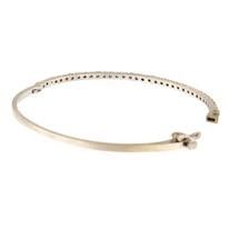 Silver hinged bangle bracelet with embedded small gems.