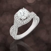 Diamond engagement ring with a large center stone and a halo of smaller diamonds.