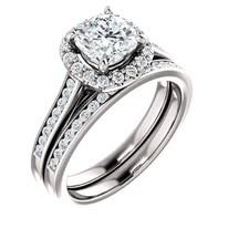Diamond engagement ring and wedding band set, with a square center stone surrounded by small diamonds.
