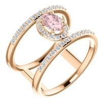 Rose gold ring with a pink oval gemstone surrounded by diamonds.