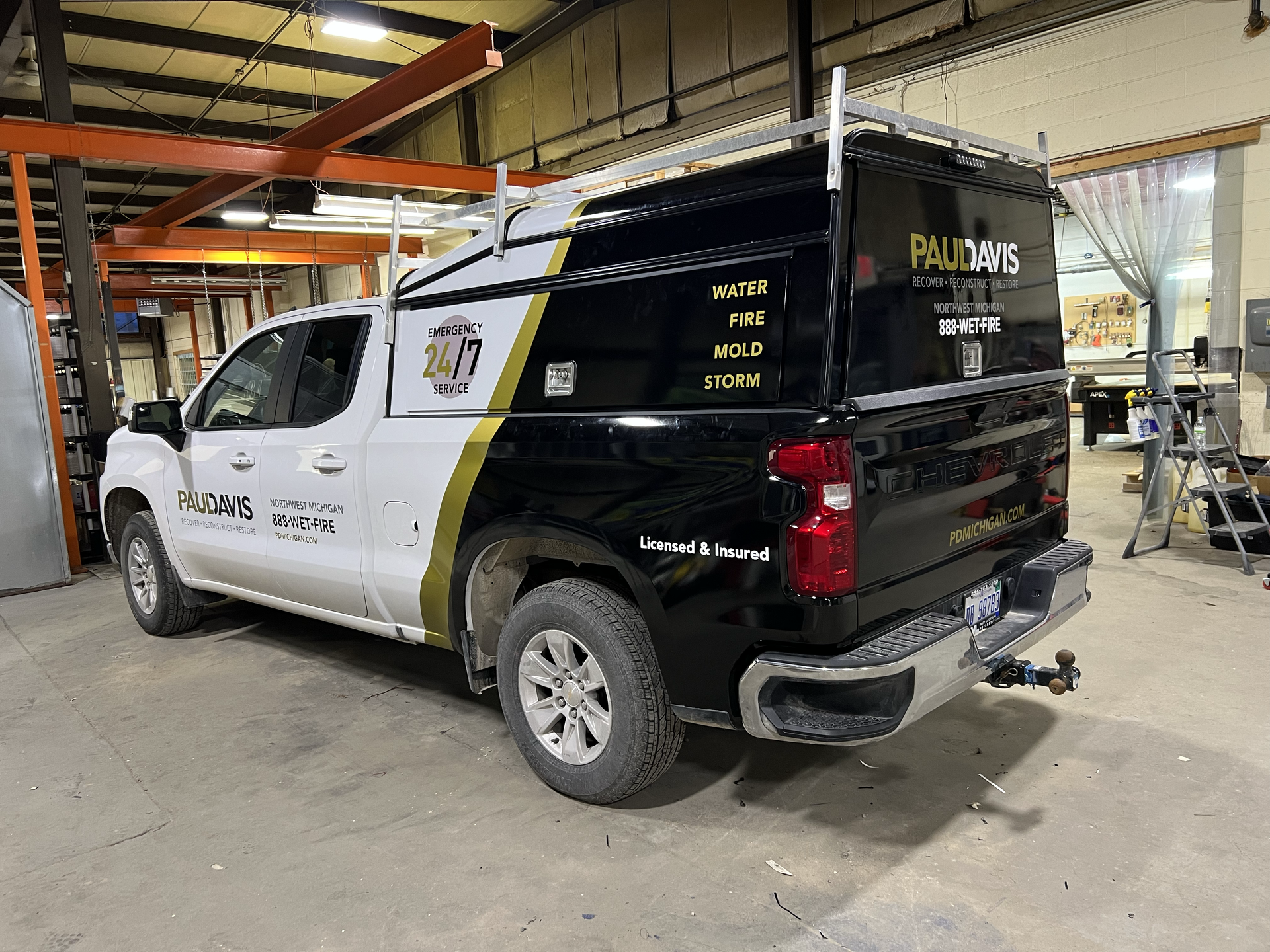 paul davis restoration custom black and gold company vehicle wrap graphics