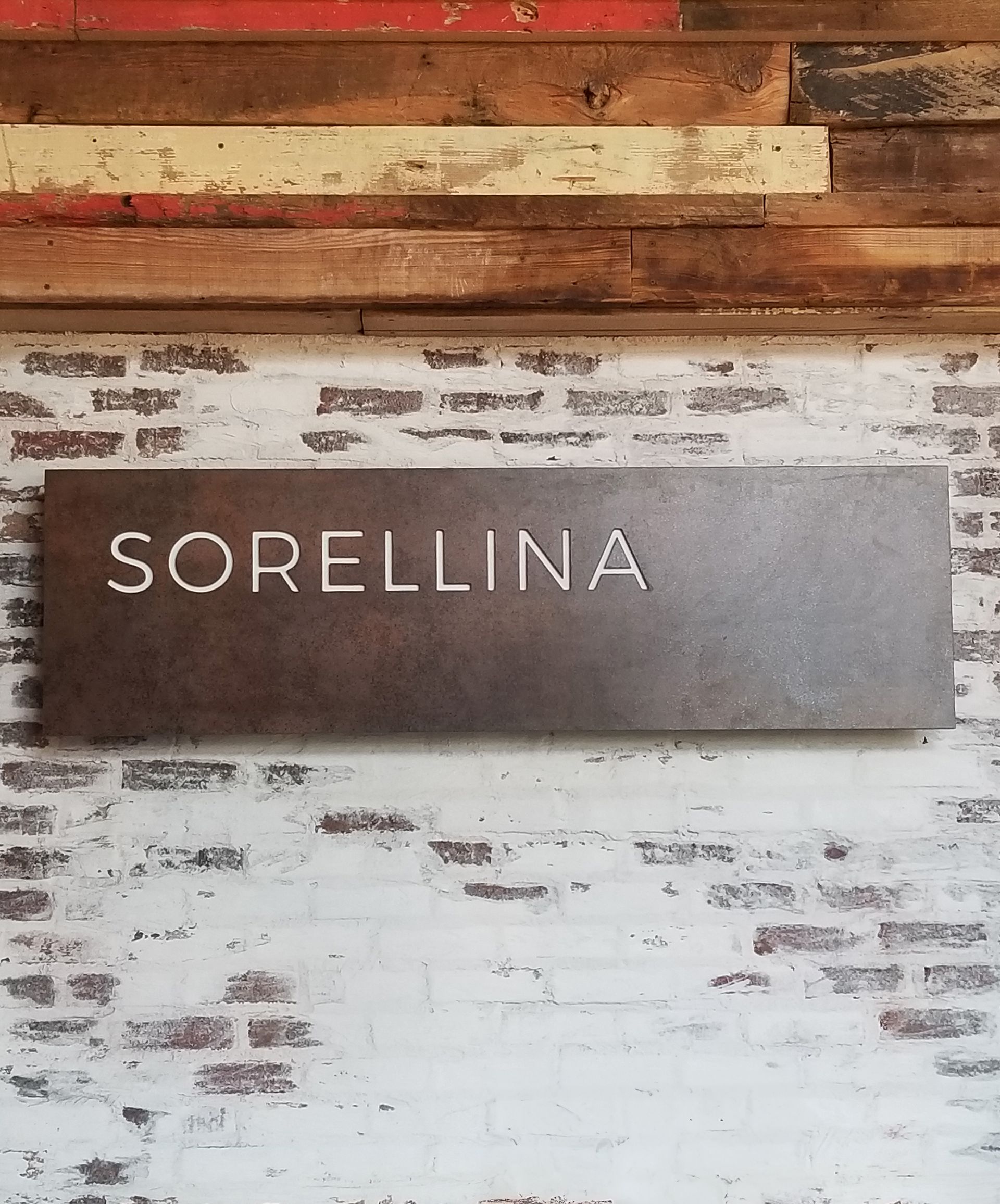 sorellina restaurant custom interior routed wood sign