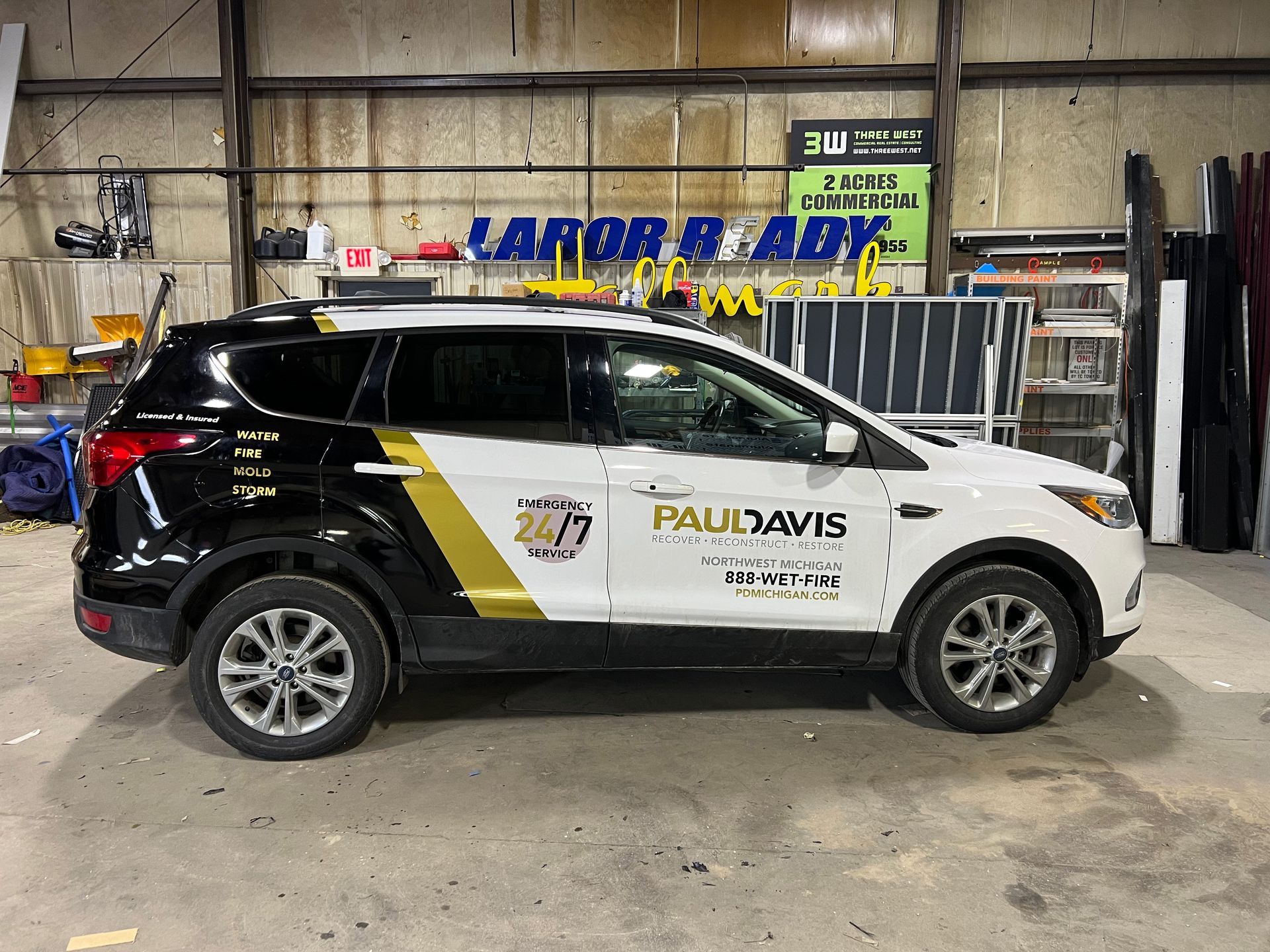 paul davis restoration custom black and gold company vehicle wrap graphics