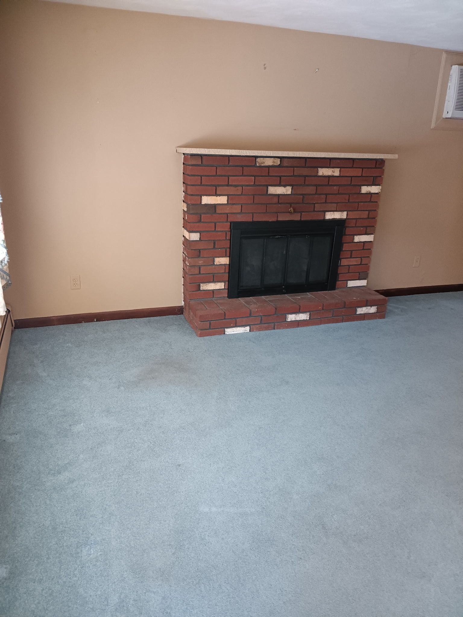 There is a fireplace in the middle of the room.