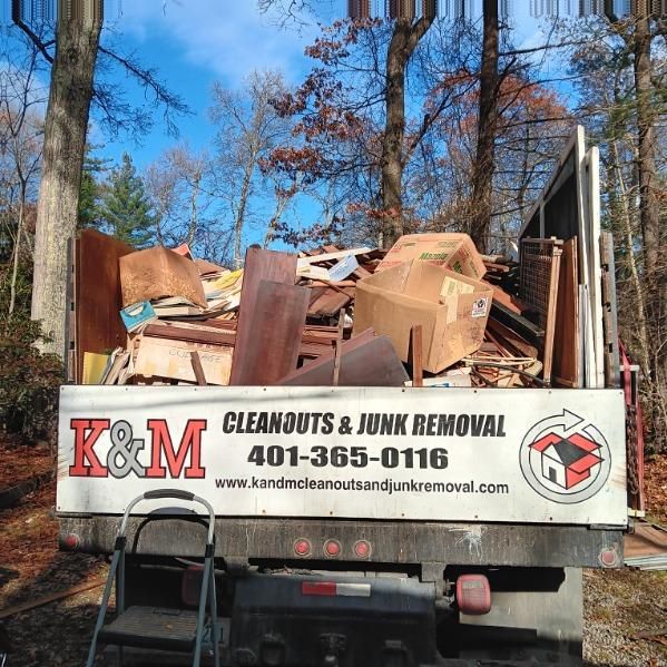 a truck with a sign that says cleanouts and junk removal