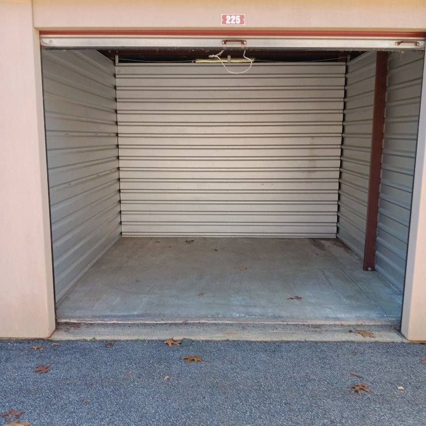 an empty garage with the number 1212 on the door