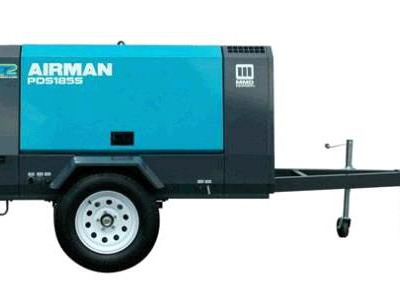 Blue and black Airman PDS185S portable air compressor on a trailer, white wheel.