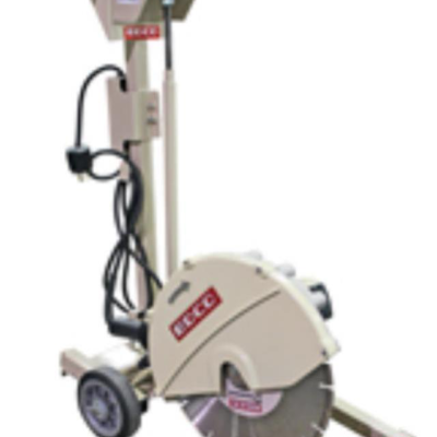 Concrete saw on wheels, tan and gray, with exposed blade and power cord.