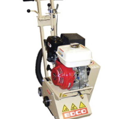 Tan and red EDCO floor scraper machine with engine and handle.