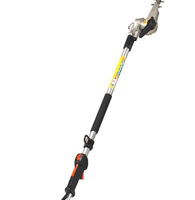 Pole hedge trimmer, extended, ready for use. Silver blade, black grip, orange accents, yellow and black pole.