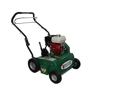 Green and red lawn aerator with black handle and silver wheels.