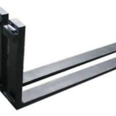 Forklift forks, black, angled up and away, for lifting pallets.