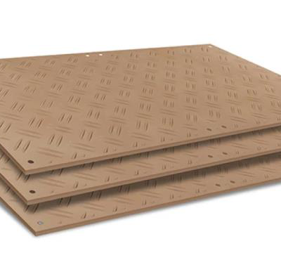 Three brown, textured, diamond-patterned mats stacked on top of each other.