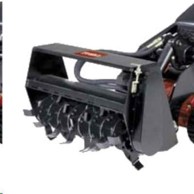 Black tiller attachment on a compact machine, designed for tilling soil.