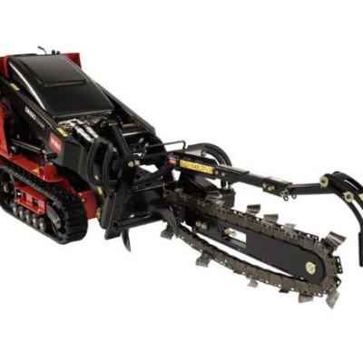 Red and black trenching machine, angled, outdoors.