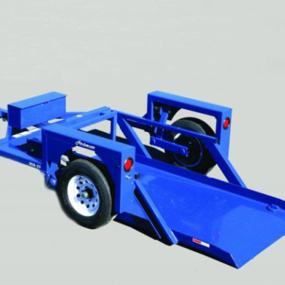Blue trailer with a flatbed and wheels, likely for towing.