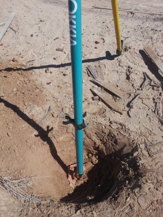 A blue pole with the word vivia on it