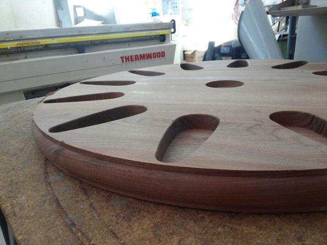 a round piece of wood with the word thermowood on it