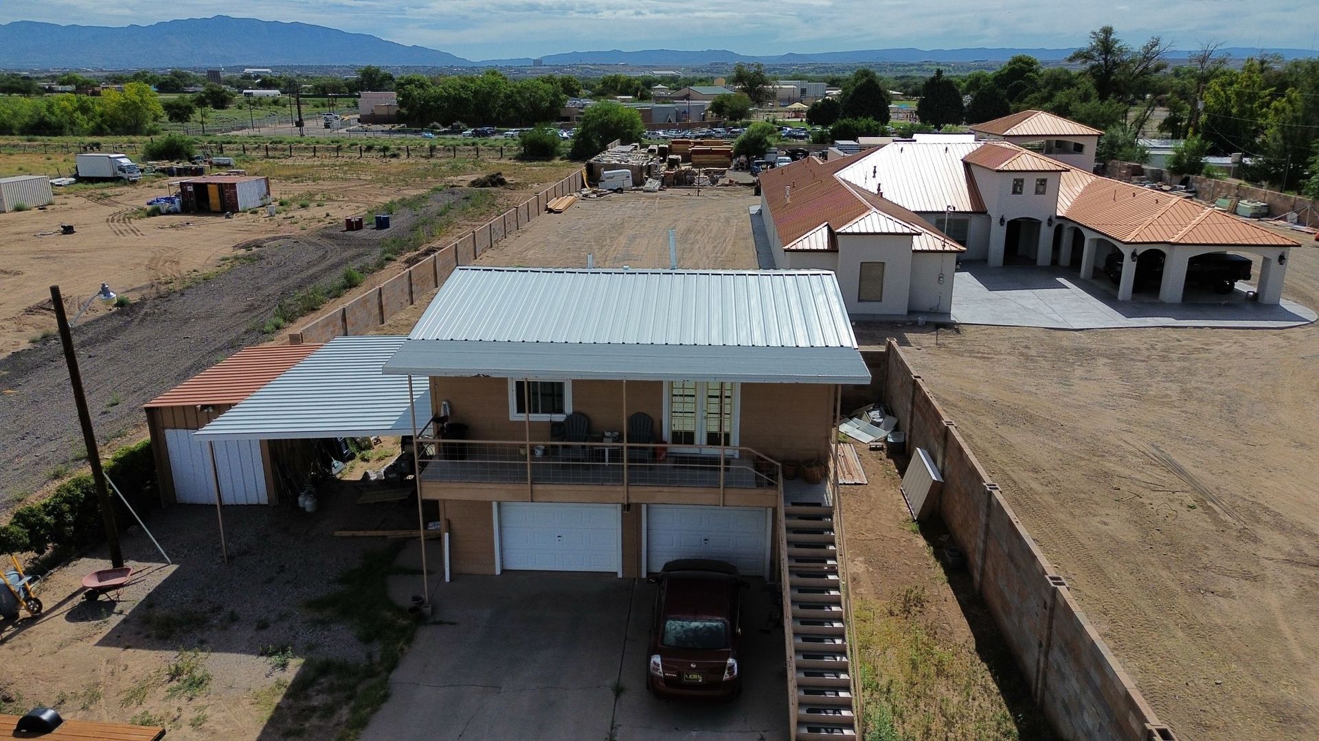 Two-story house with a white roof and attached garage.