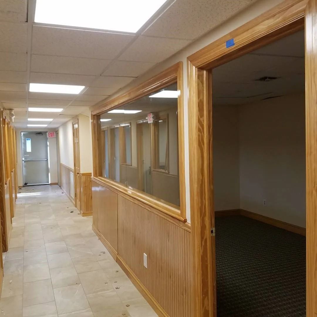 A long hallway with a lot of windows and doors