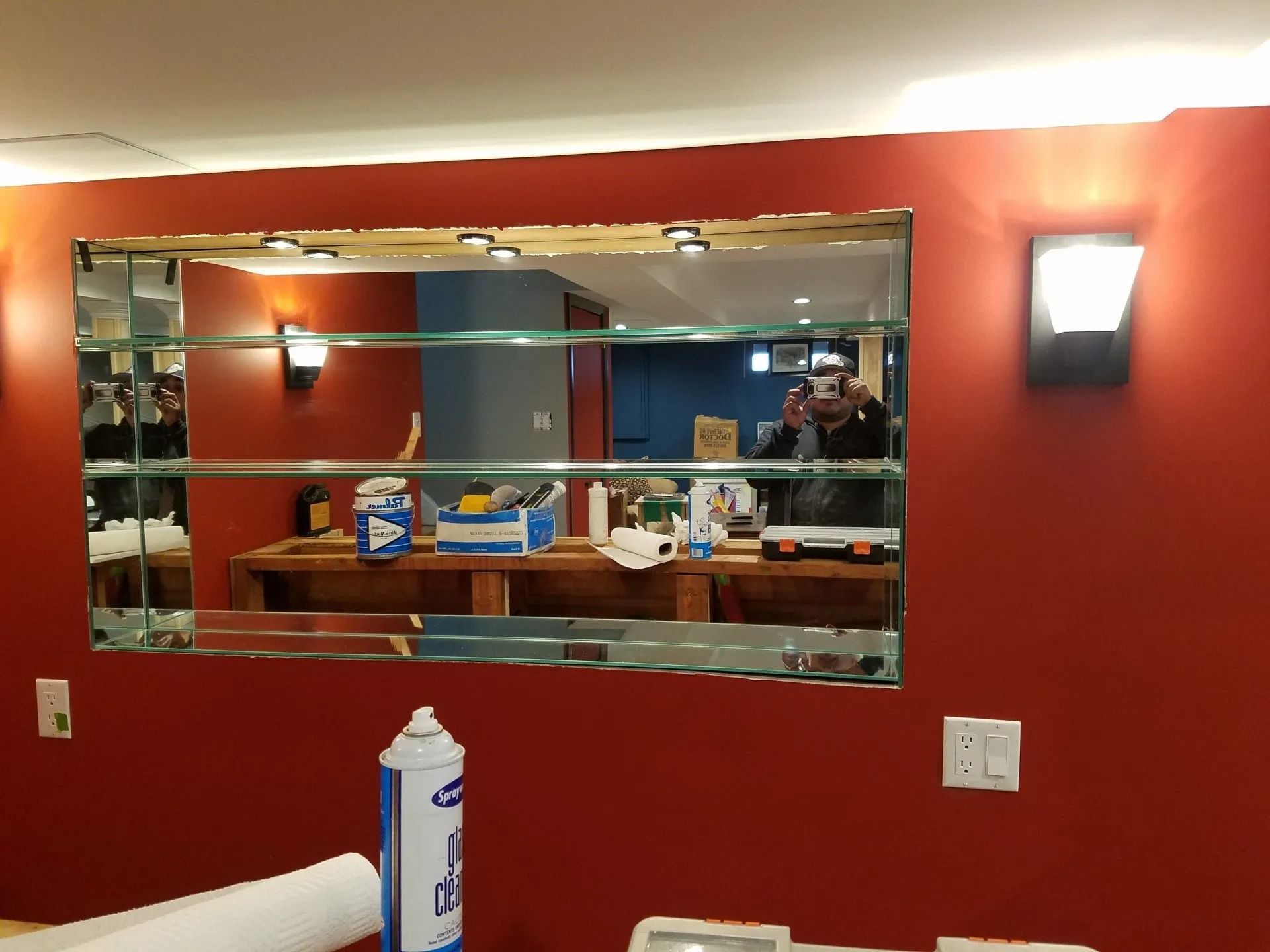 A man is taking a picture of himself in a mirror