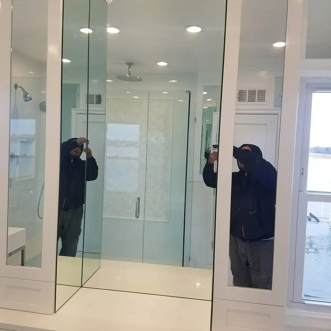 A man taking a picture of himself in a bathroom mirror