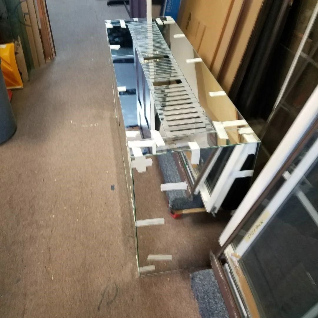 A mirrored shelf with the letter f on it