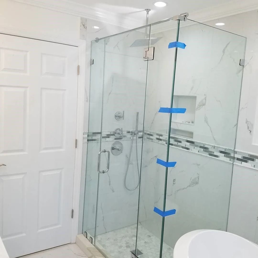 A bathroom with a walk in shower and a toilet