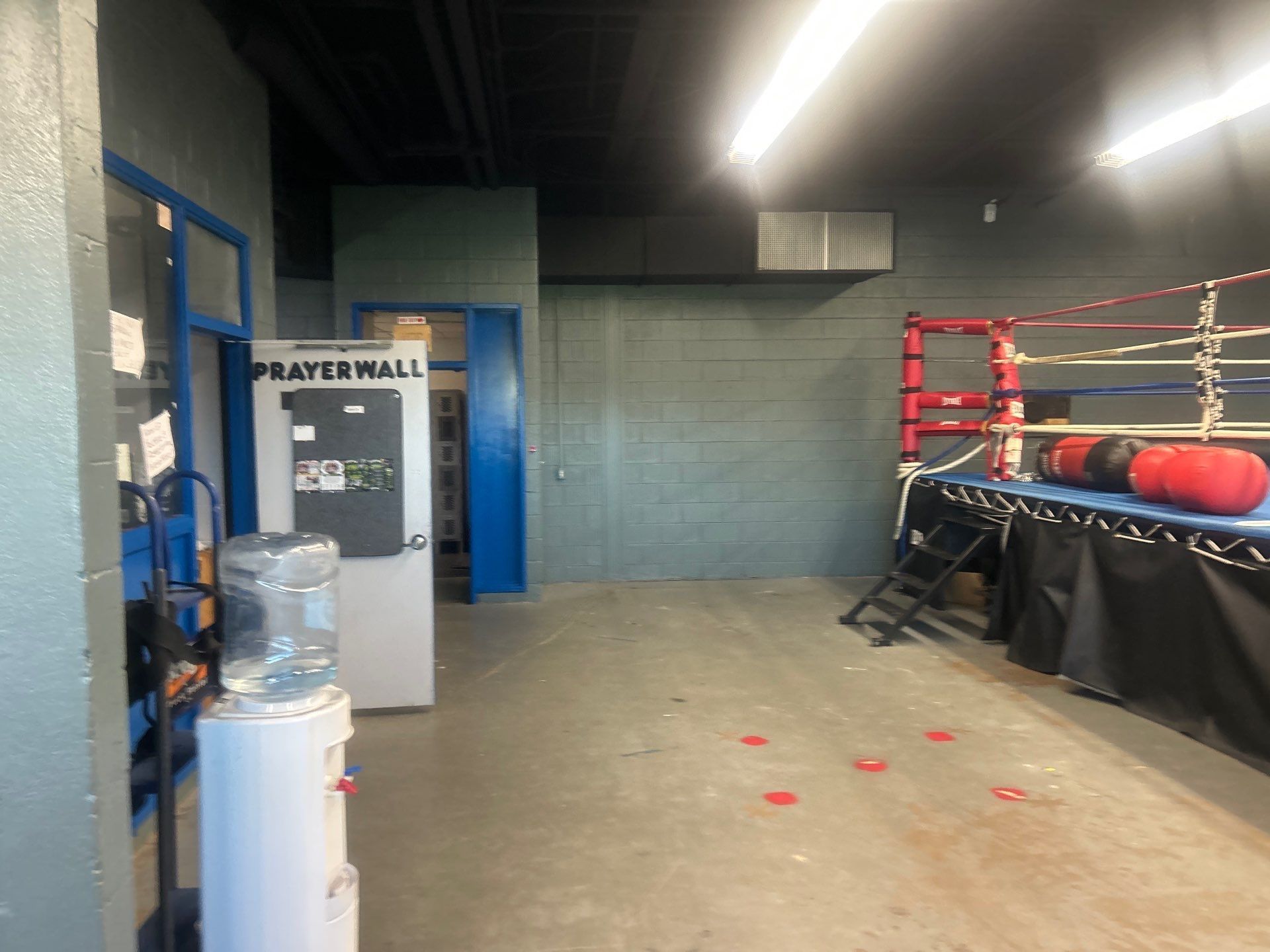 Empty boxing gym with ring
