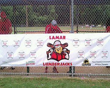 A lamar lumberjacks banner is hanging on a chain link fence