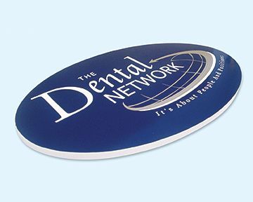 A blue oval coaster with the dental network logo on it