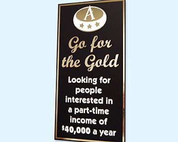 A sign that says go for the gold looking for people interested in a part-time income of $ 40,000 a year