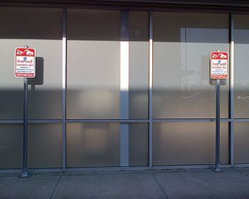 A building with a lot of windows and a lot of signs