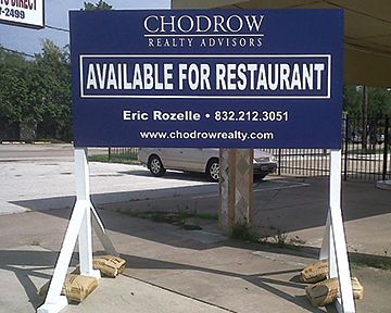 A chodrow realty advisors sign that says available for restaurant