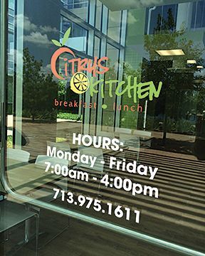 A glass door with a sign on it that says citrus kitchen.