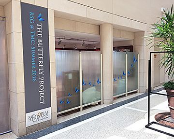 A building with a sign that says the butterfly project