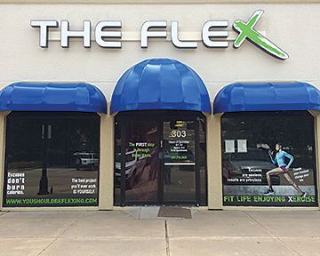 A store front for the flex with blue awnings
