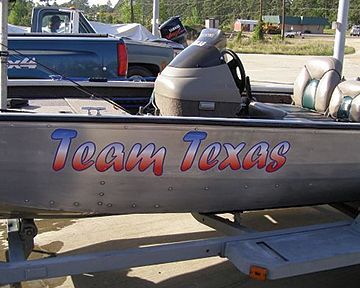 A silver boat with team texas written on the side