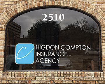 A brick building with a window that says higdon compton insurance agency