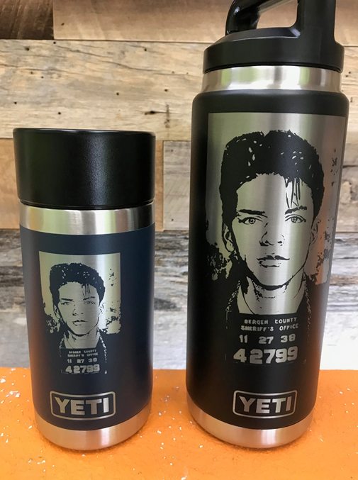 Two Yeti bottles with a picture of a man on them.