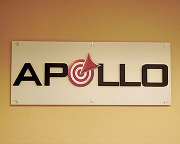 A white sign with the word apollo on it