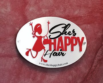 A sticker that says she 's happy hair on it
