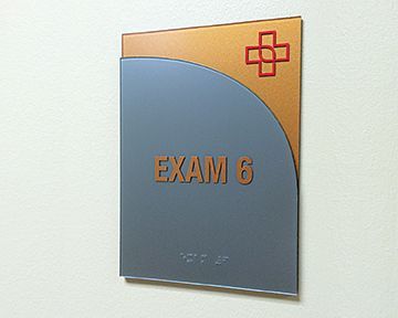 A sign on a wall that says exam 6
