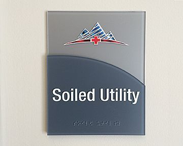 A sign on a wall that says soiled utility