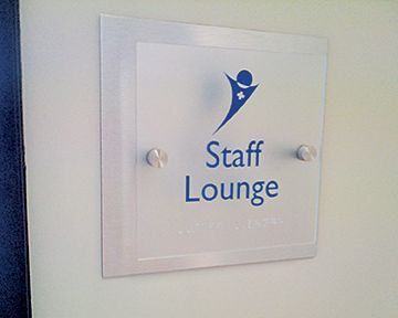 A sign on a wall that says staff lounge